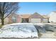 Charming brick home featuring an attached three car garage and well-maintained landscaping at 5316 Twin Bridge Blvd, Indianapolis, IN 46239