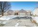 Charming brick home featuring an attached three car garage and well-maintained landscaping at 5316 Twin Bridge Blvd, Indianapolis, IN 46239
