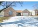 Charming brick home featuring an attached three car garage and well-maintained landscaping at 5316 Twin Bridge Blvd, Indianapolis, IN 46239