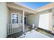 Charming covered front porch with windows and space for seating area at 5316 Twin Bridge Blvd, Indianapolis, IN 46239