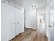 Hallway with wood flooring, neutral walls and a closet at 5316 Twin Bridge Blvd, Indianapolis, IN 46239
