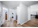 Hallway featuring wood flooring, neutral walls and multiple doorways at 5316 Twin Bridge Blvd, Indianapolis, IN 46239