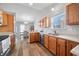 Open kitchen with a view to dining area. Lots of wooden cabinets at 5316 Twin Bridge Blvd, Indianapolis, IN 46239