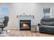 Close up of living room with fireplace, sleek floors and comfortable seating at 5316 Twin Bridge Blvd, Indianapolis, IN 46239
