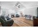 Spacious living room with fireplace, and wood flooring throughout at 5316 Twin Bridge Blvd, Indianapolis, IN 46239