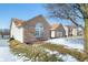 Well-maintained side yard with brick exterior and snow-covered lawn at 5316 Twin Bridge Blvd, Indianapolis, IN 46239