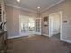 Elegant entryway featuring beautiful flooring, trim, and a glimpse into the spacious living area at 5558 Tart Blvd, Indianapolis, IN 46239
