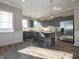 Modern kitchen featuring stainless steel appliances, a spacious island, and stylish gray cabinetry at 5558 Tart Blvd, Indianapolis, IN 46239