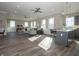 Open-concept living area with hardwood floors, recessed lighting, modern furniture, and plenty of natural light at 5558 Tart Blvd, Indianapolis, IN 46239
