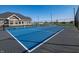 Community tennis court surrounded by fencing and landscaping for recreational activities at 5558 Tart Blvd, Indianapolis, IN 46239