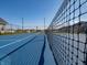 Community tennis court surrounded by fencing and landscaping for recreational activities at 5558 Tart Blvd, Indianapolis, IN 46239