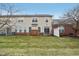 A view of the backyard and exterior of a two-story home with a lawn and patio area at 5682 Castor Way, Noblesville, IN 46062