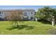 Backyard with a well-maintained lawn, patio area, and mature trees creating a serene setting at 5682 Castor Way, Noblesville, IN 46062
