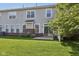 Backyard featuring a sliding glass door leading to a patio and a well-manicured lawn at 5682 Castor Way, Noblesville, IN 46062