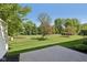 Backyard featuring a lovely grassy lawn, patio, and tree coverage at 5682 Castor Way, Noblesville, IN 46062