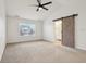 Bedroom features a barn door leading to the bathroom and a window with natural light at 5682 Castor Way, Noblesville, IN 46062