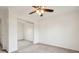 Cozy bedroom featuring mirrored closet doors and a lighted ceiling fan at 5682 Castor Way, Noblesville, IN 46062