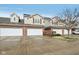 Charming townhome featuring a brick facade, attached two-car garage, and well-maintained landscaping at 5682 Castor Way, Noblesville, IN 46062