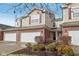 Attractive townhome featuring a brick facade, attached two-car garage, and landscaping at 5682 Castor Way, Noblesville, IN 46062