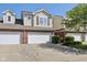 Charming townhouse showcasing attached garages, and manicured landscaping at 5682 Castor Way, Noblesville, IN 46062