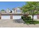 Charming two-story townhouse with a brick facade, manicured lawn, and attached one-car garage at 5682 Castor Way, Noblesville, IN 46062