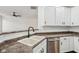 Kitchen features modern faucet, stainless steel dishwasher, and white cabinets at 5682 Castor Way, Noblesville, IN 46062