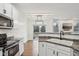Bright kitchen features modern appliances, a sleek countertop, and an open floor plan at 5682 Castor Way, Noblesville, IN 46062