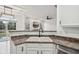 Modern kitchen featuring white cabinets and stainless steel appliances at 5682 Castor Way, Noblesville, IN 46062