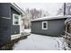 View of the backyard showcasing the home's siding and the detached garage at 5736 Central Ave, Indianapolis, IN 46220
