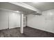 Finished basement space with carpet, painted walls, and built-in shelving, offering potential for various uses at 5736 Central Ave, Indianapolis, IN 46220