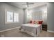 Neutral bedroom with gray quilt, orange pillows, and matching sconces at 5736 Central Ave, Indianapolis, IN 46220