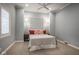 A cozy bedroom with neutral walls, carpet, and natural light at 5736 Central Ave, Indianapolis, IN 46220