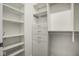 Walk-in closet with built-in shelving and storage space at 5736 Central Ave, Indianapolis, IN 46220