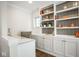 Bright home office featuring a built-in bookcase, sleek desk, and ample storage at 5736 Central Ave, Indianapolis, IN 46220