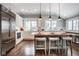 Modern kitchen with stainless steel appliances, a large island, and plenty of storage space at 5736 Central Ave, Indianapolis, IN 46220