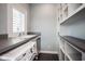 Bright laundry room featuring modern appliances, ample counter space, and built in storage at 5736 Central Ave, Indianapolis, IN 46220