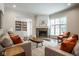 Inviting living room with a cozy fireplace, hardwood floors, and stylish decor at 5736 Central Ave, Indianapolis, IN 46220