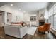 Spacious living room featuring a fireplace, built-in shelves, and a cozy seating area at 5736 Central Ave, Indianapolis, IN 46220