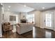 Cozy living room showcasing a brick fireplace, hardwood floors, and a welcoming seating arrangement at 5736 Central Ave, Indianapolis, IN 46220