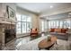Bright and airy living room with a cozy fireplace, hardwood floors, and comfortable seating at 5736 Central Ave, Indianapolis, IN 46220