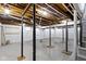 Unfinished basement with concrete floor and exposed ceiling at 5814 Beechwood Ave, Indianapolis, IN 46219