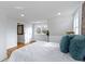 Bright bedroom featuring hardwood floors, white trim, and ensuite bathroom at 5814 Beechwood Ave, Indianapolis, IN 46219