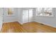 Bedroom features hardwood floors, white walls, and sliding closet doors at 5814 Beechwood Ave, Indianapolis, IN 46219