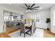 Open dining room showcasing modern fixtures, natural light, and an open layout to the kitchen at 5814 Beechwood Ave, Indianapolis, IN 46219