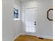 Bright entryway featuring a stained glass window and white painted walls at 5814 Beechwood Ave, Indianapolis, IN 46219
