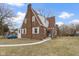 Charming brick home featuring a unique Tudor-style design and classic architectural details at 5814 Beechwood Ave, Indianapolis, IN 46219