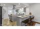 Modern kitchen with a large island, stainless steel appliances, and gray cabinetry at 5814 Beechwood Ave, Indianapolis, IN 46219