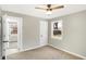 Bedroom featuring neutral walls, carpet, and a large window for plenty of natural light at 6104 Gifford St, Indianapolis, IN 46228