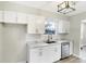 Well-lit kitchen featuring stainless steel appliances, white subway tile backsplash, and modern hardware at 6104 Gifford St, Indianapolis, IN 46228