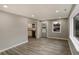 Inviting living room with hardwood floors, ample natural light, and a view into the adjacent kitchen at 6104 Gifford St, Indianapolis, IN 46228